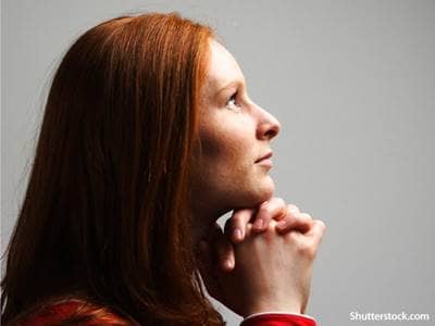 woman praying thinking